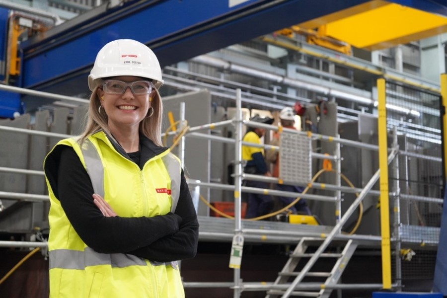 Image of a woman wearing a hi vis vest and hard hat